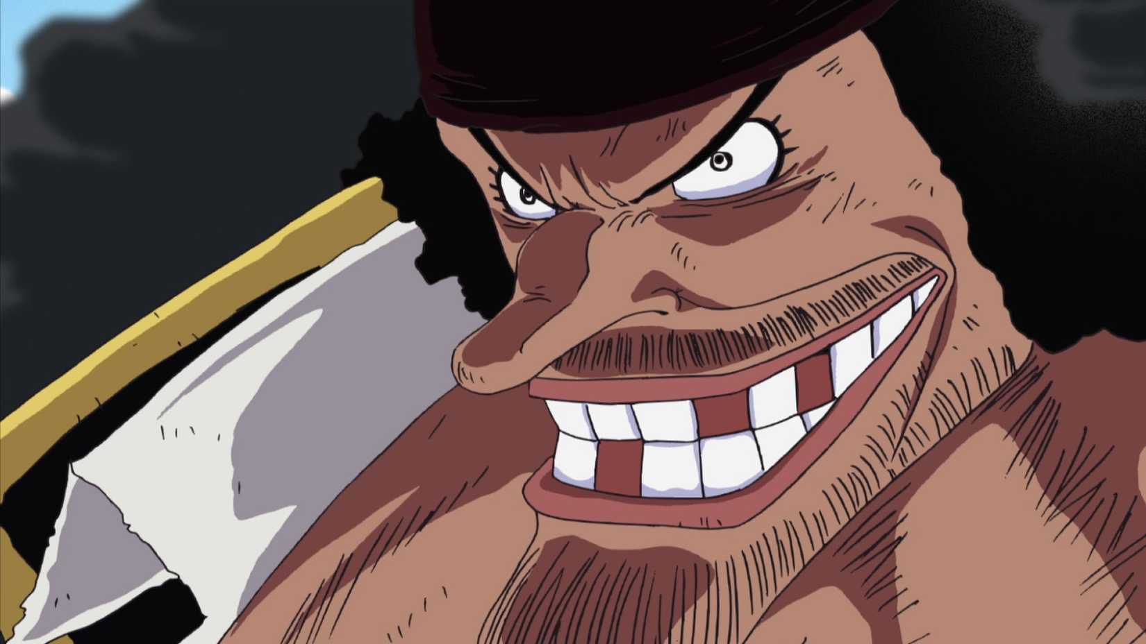 Blackbeard is grinning against a black background in One Piece