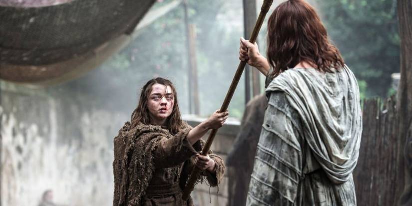 A blind Arya Stark tries to hit Jaqen with her staff, but he catches it during Season 6 of Game of Thrones