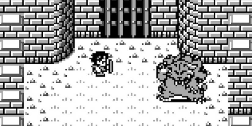Final Fantasy Adventure Gameplay with hero fighting monster in arena.
