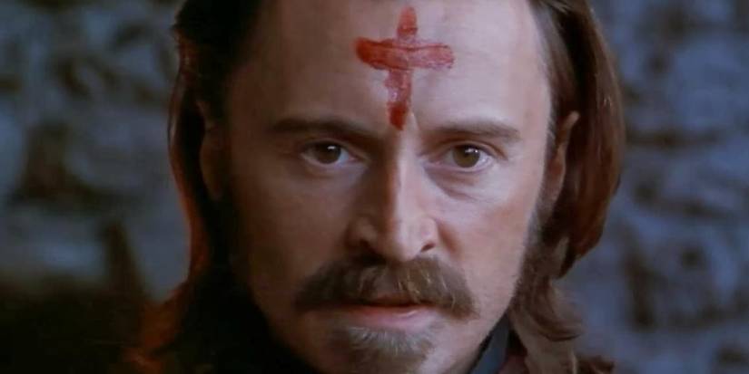 Colonel Ives (Robert Carlyle) paints a bloody cross on his face in Ravenous.