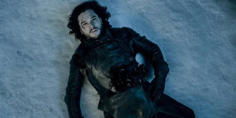 Jon Snow lying dead in the snow in Game of Thrones.
