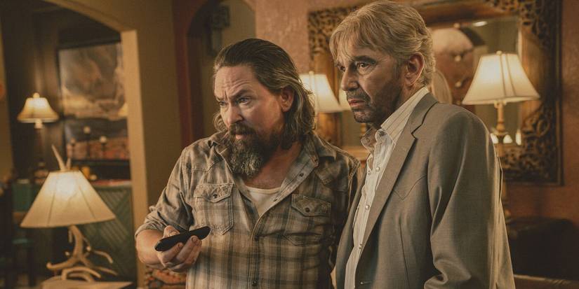 Dale (James Jordan) in a plaid shirt next to Tommy (Billy Bob Thornton) in a grey suit in Landman