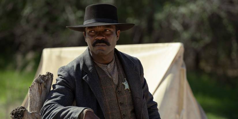 Bass Reeves (David Oyelowo) from Lawmen: Bass Reeves looks to the side with a concerned expression.