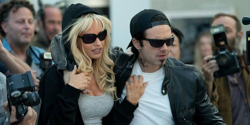 Lily James as Pamela Anderson and Sebastian Stan as Tommy Lee evading paparazzi from Pam & Tommy