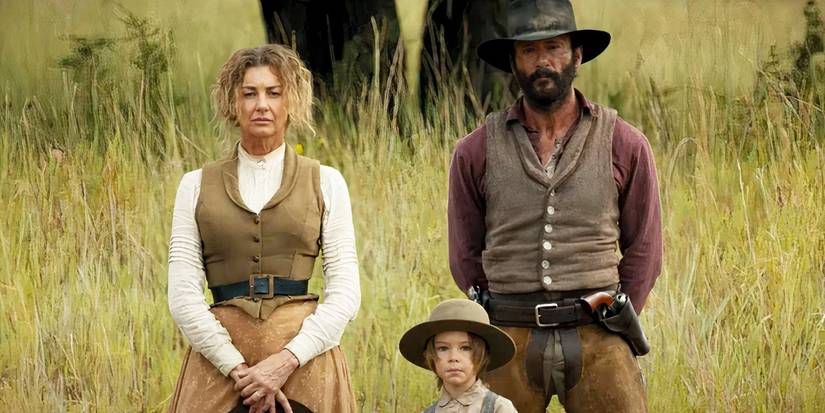 James and Margaret Dutton with their son John in the middle of a field while traveling west together in 1883.
