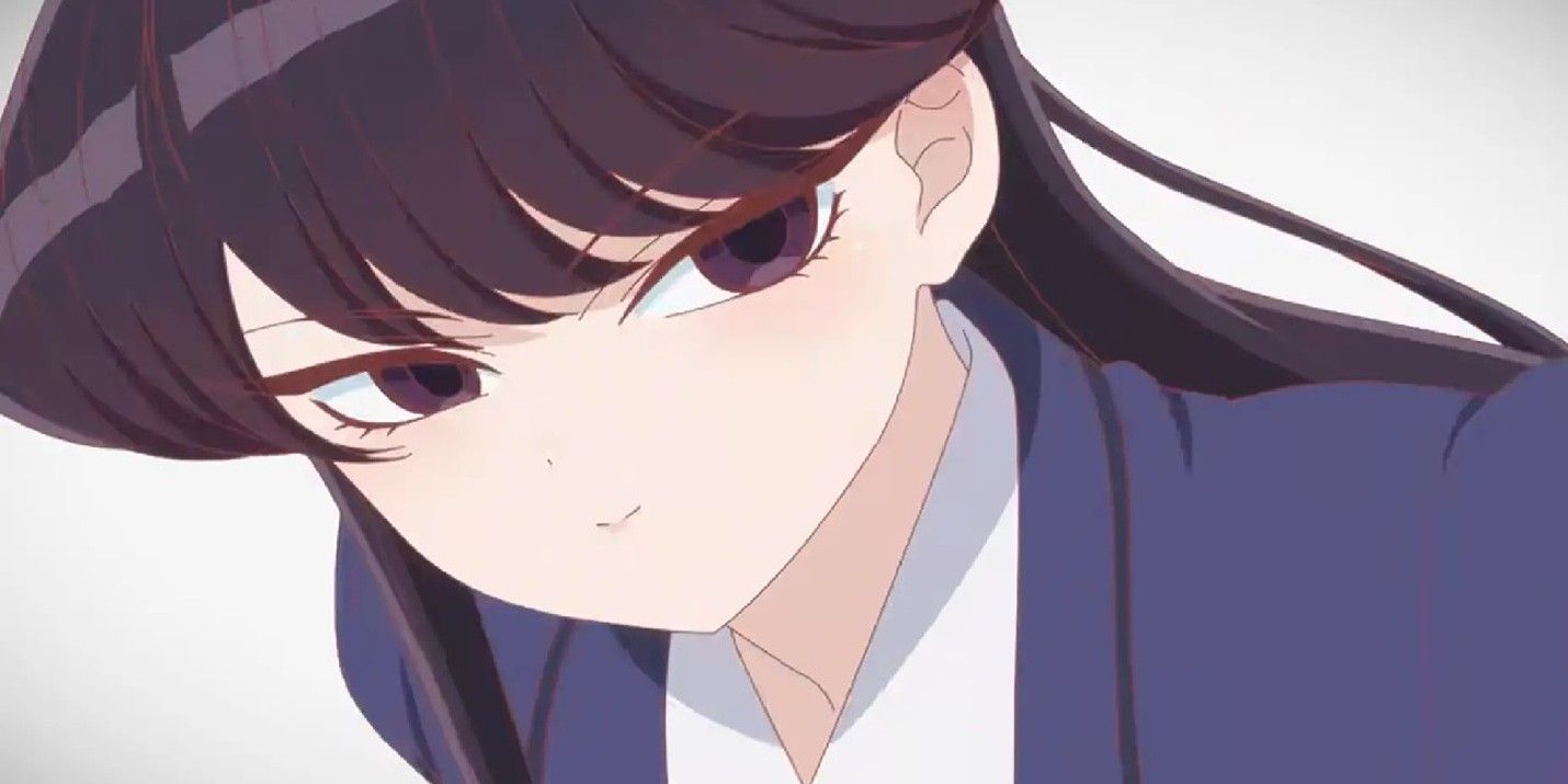 Shoko Komi looks on the side while making a little smile in the Komi cannot communicate the anime.