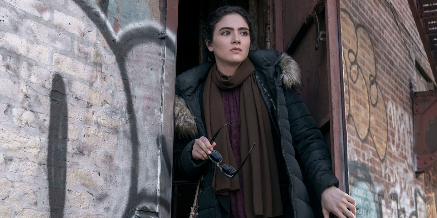 Noor, played by Arienne Mandi, in doorway of a graffiti-covered building in The Night Agent Season 2