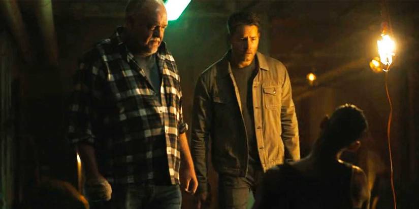 Keaton and Colter interrogating a man tied to a chair in a basement in Tracker.