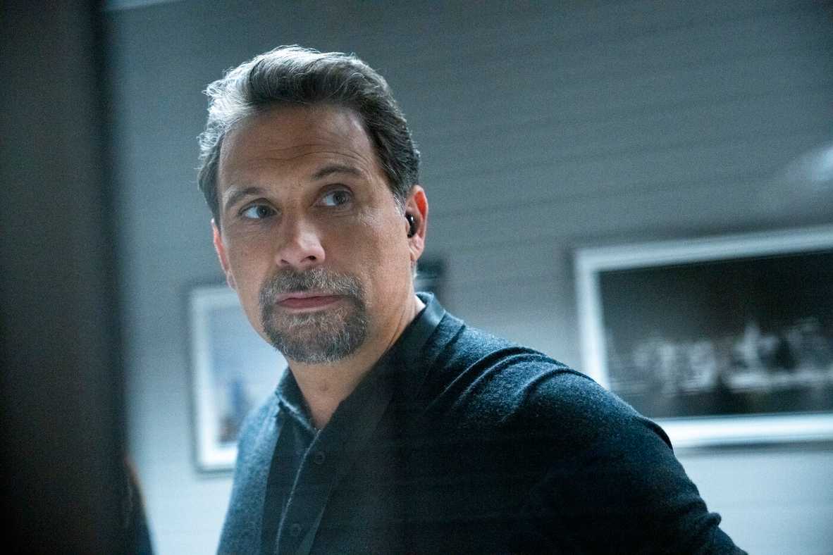 Close-up of Jubal Valentine, played by Jeremy Sisto, wearing a black polo shirt in the TV show FBI