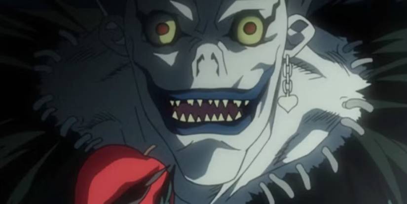 Ryuk is holding an apple in his hand while smiling in Death Note.