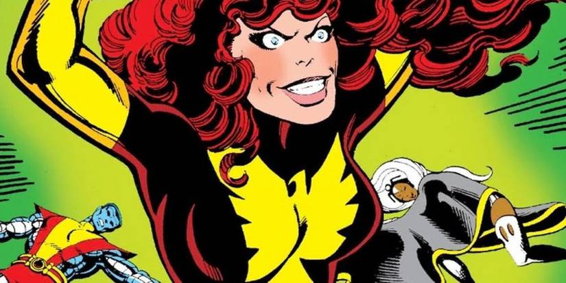 Jean Grey has a sinister look on her face as the collapsed bodies of Storm and Beast are seen in the background in Marvel Comics' Dark Phoenix Saga.