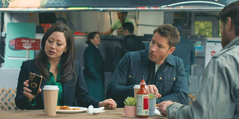 Fiona Rene as Reenie and Justin Hartley as Colter eating lunch in Tracker 'Off the Books'