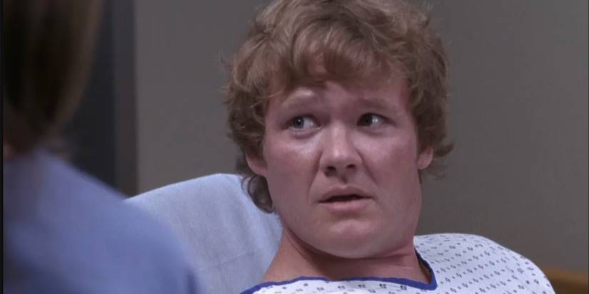 A patient looking at baily after swallowing doll heads in grey's anatomy