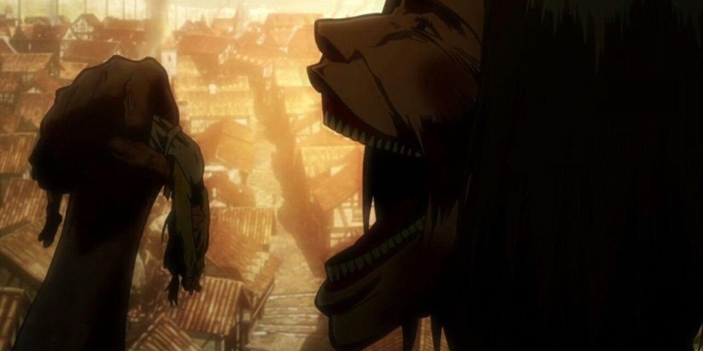The Smiling Titan opens its mouth to eat Eren's mother in Attack on Titan