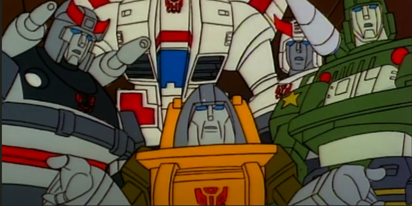 Brawn talks with other Transformers in the background in G1 Transformers cartoon.