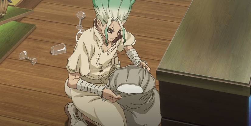 Senku examines a bag of kudzu flour in Dr. Stone: Science Future.
