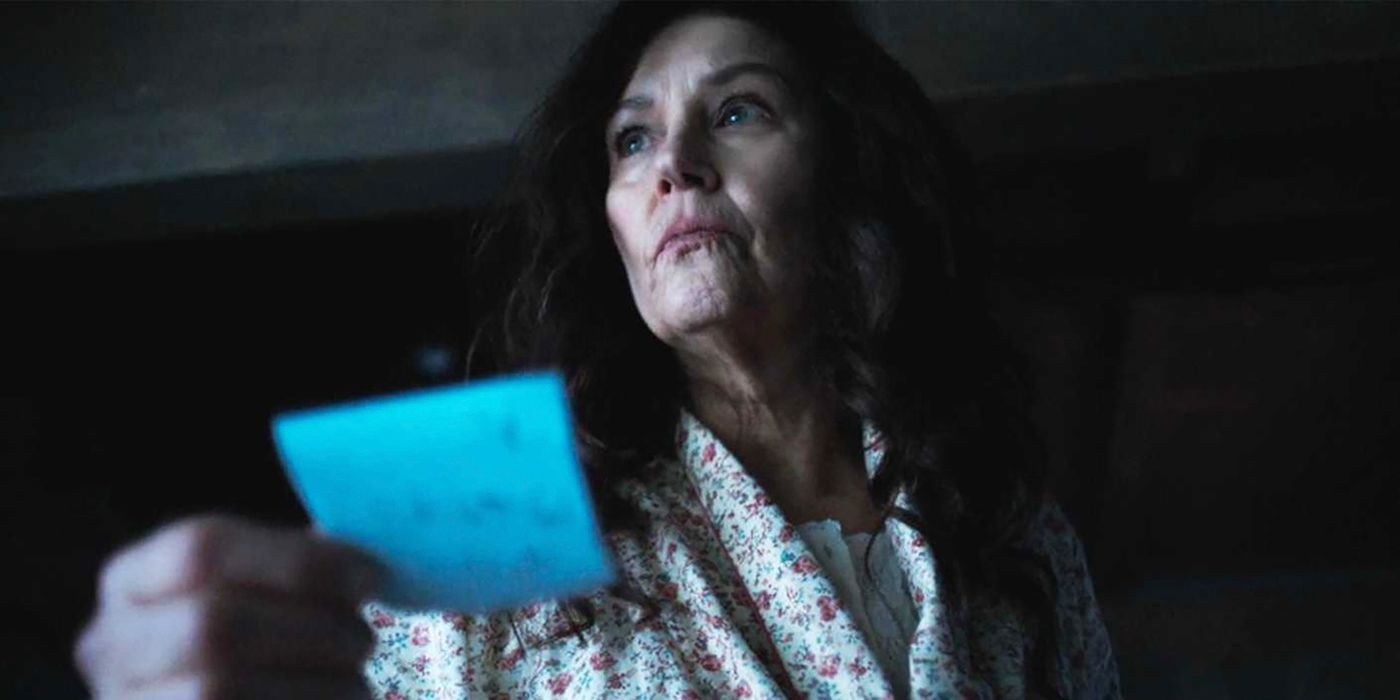 Mary in a robe looking worried while holding a note in Tracker.