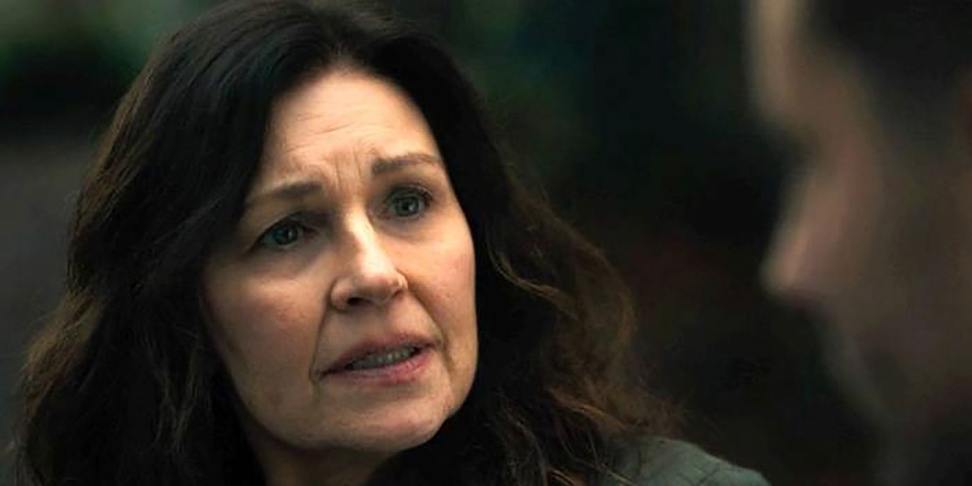 Mary pleading with her son Colter in Tracker as they sit together on a bench.