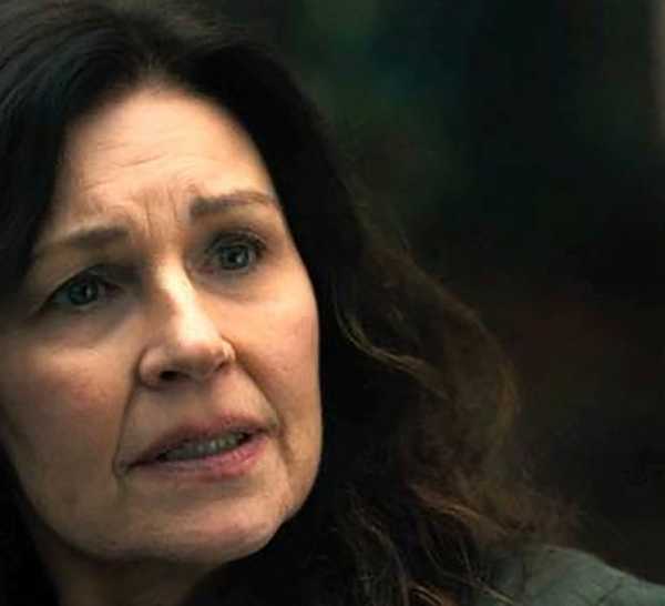 Mary pleading with her son Colter in Tracker as they sit together on a bench.