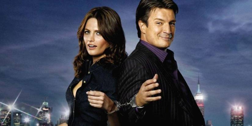 Stana Katic as Detective Kate Beckett and Nathan Fillion as Richard Castle handcuffed together.