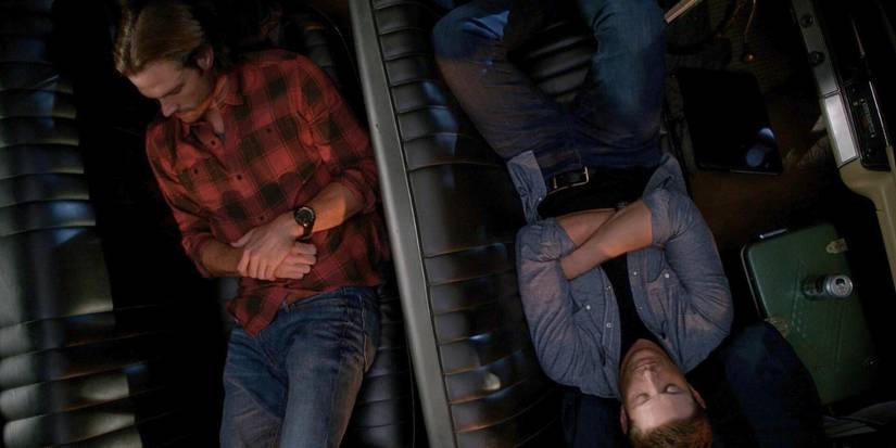 Jared Padalecki like Sam and Jensen Ackles as Dean sleeping in the Impala in the supernatural 