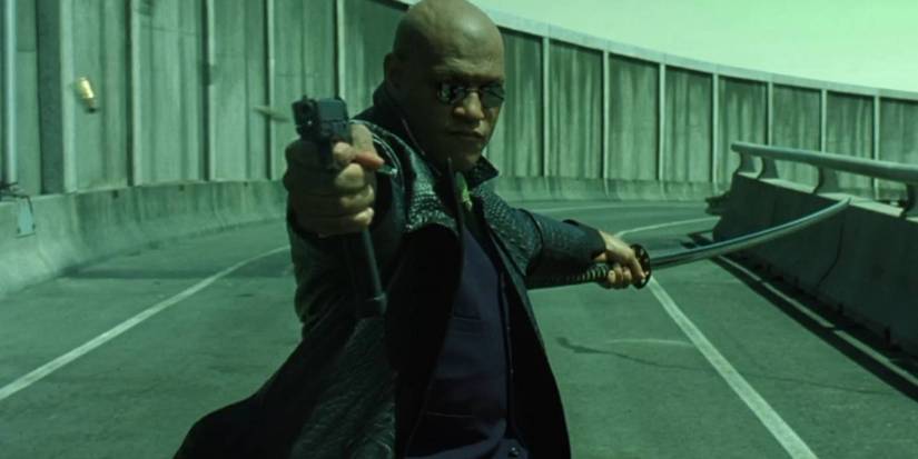 Morpheus draws his weapon and sword in The Matrix Reloaded.