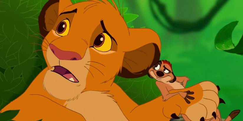 Timon watches as Simba asks "What's a motto?" in The Lion King (1994)