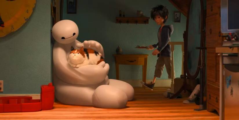 Baymax sitting on the floor and petting a cat in Big Hero 6.