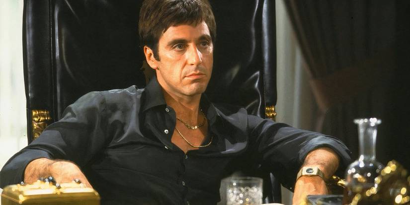 Tony Montana sits on his throne in Scarface.