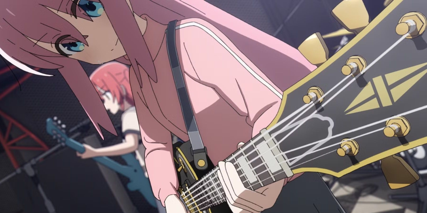 Hitori Gotoh playing guitar onstage in the Bocci the Rock! anime