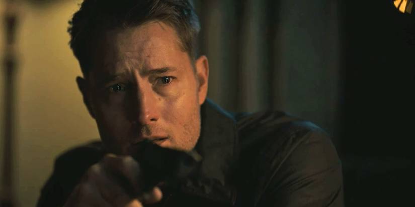Justin Hartley as Colter holding a gun on Otto in Tracker 'Echo Ridge'
