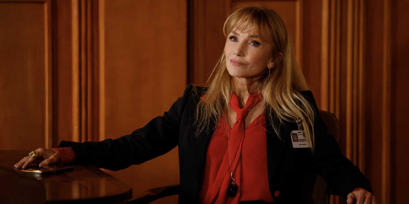Carla Marino, played by Rebecca de Mornay, seated in a black jacket and red blouse from NCIS TV show