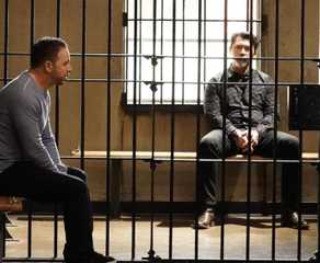 Danny Reagan (Donnie Wahlberg) speaks with Luis Delgado (Lou Diamond Phillips) while the latter is in a prison cell in Blue Bloods