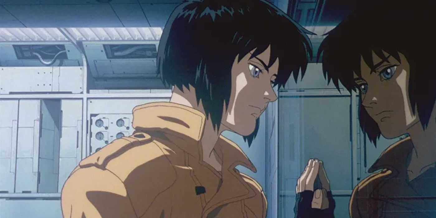 Major Motoko Kusanagi stares into a mirror at her reflection in Ghost in the Shell (1995).