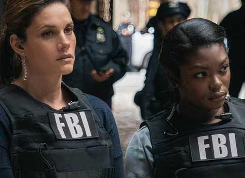 Kristen Chazal and a colleague in FBI gear in FBI
