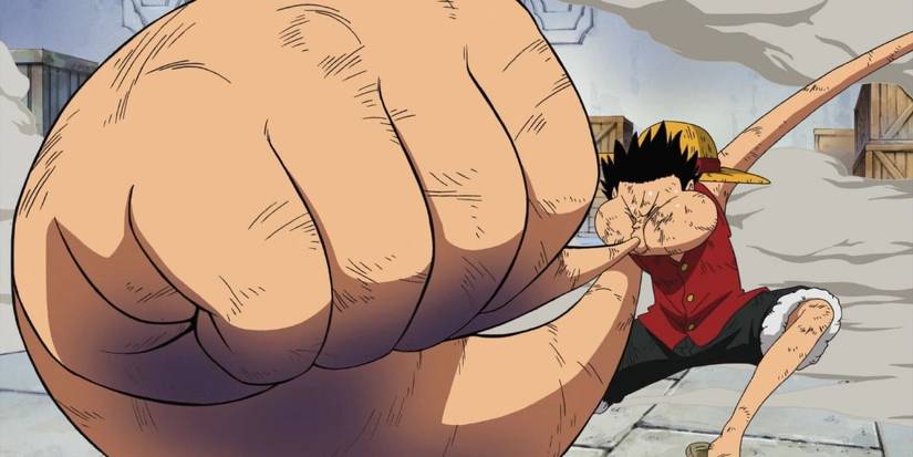 Monkey D. Luffy inflates his arm to begin gear 3 in Enies Lobby in One Piece.