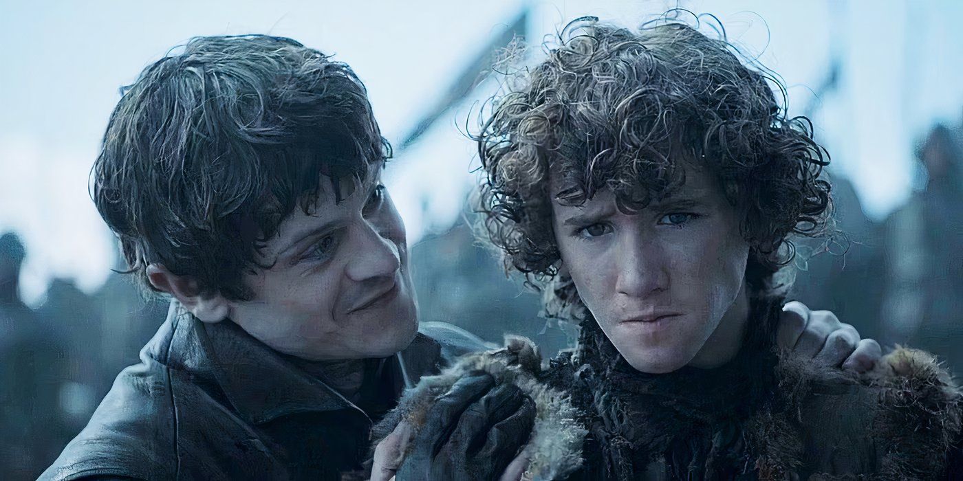 Ramsay Bolton grins menacingly at a worried Rickon Stark in Game of Thrones.