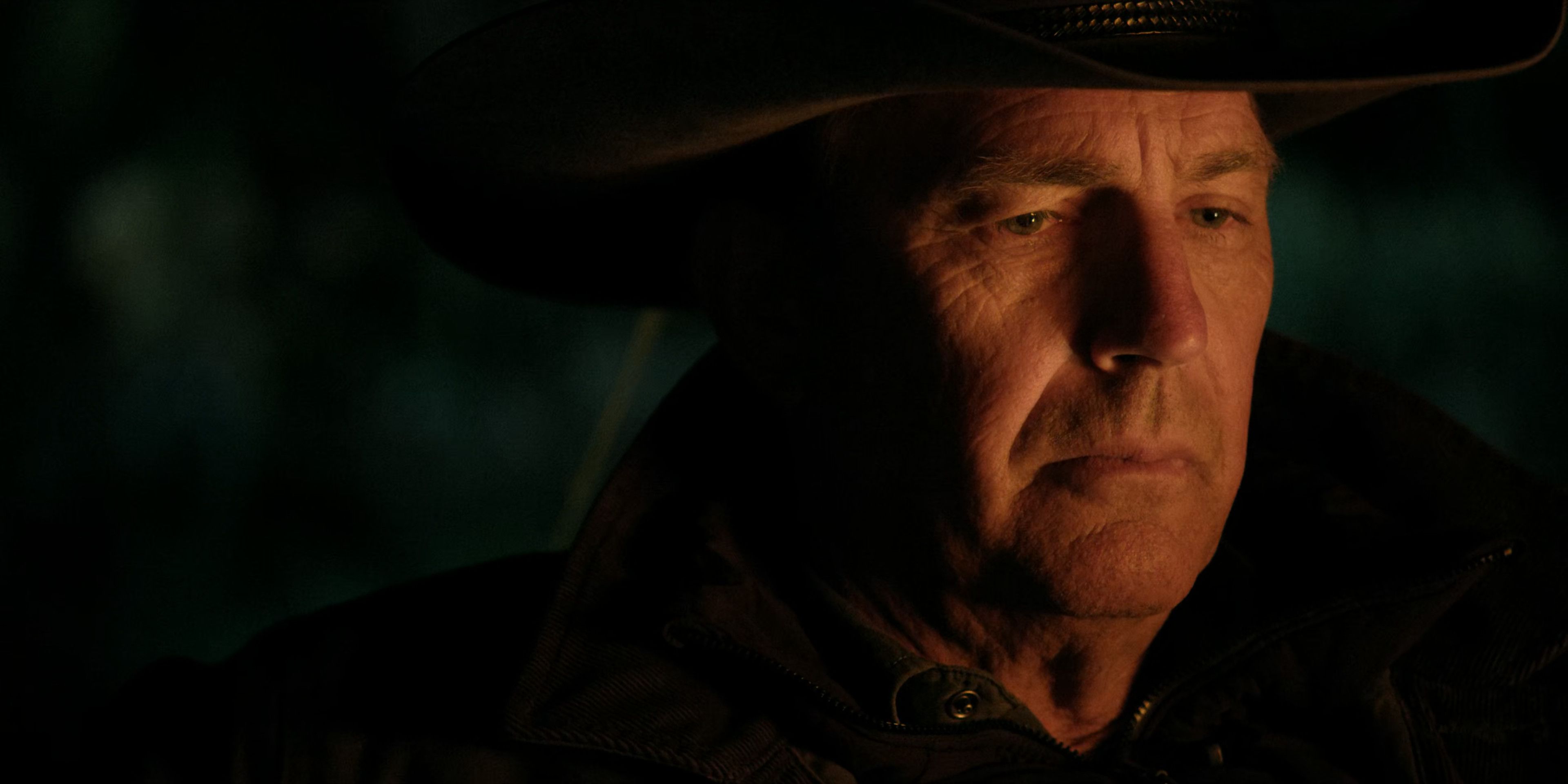 John Dutton stares into the campfire in Season 3 of Yellowstone