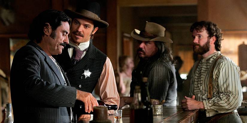 Al and Seth have a drink together and discuss strategy in Deadwood.