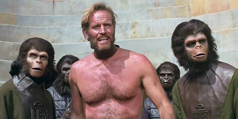 Charlton Heston as George Taylor, Roddy McDowall as Dr. Cornelius and Kim Hunter as Dr. Zira in an arena from the movie Planet of the Apes (1968)
