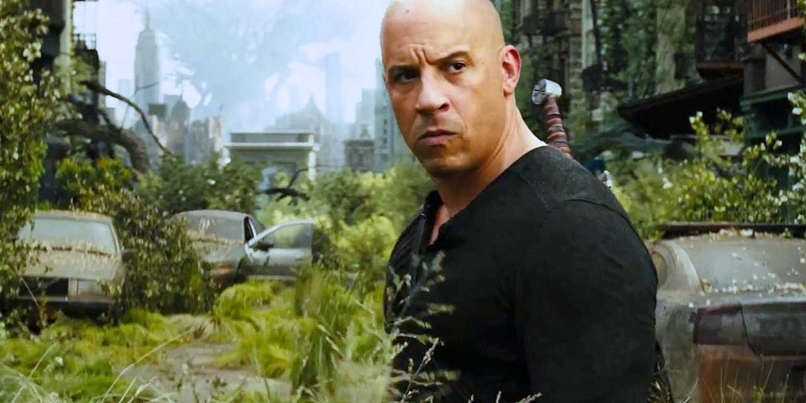 Vin Diesel as Kaldur in a shirt in a field with a sword in his back from The Last Witch Hunter