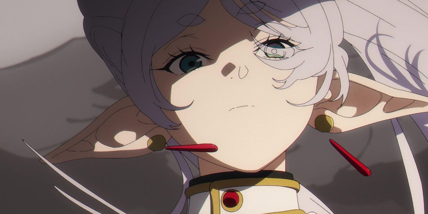 Frieren looks down on her opponent with a blank expression in Frieren: Beyond Journey's End.