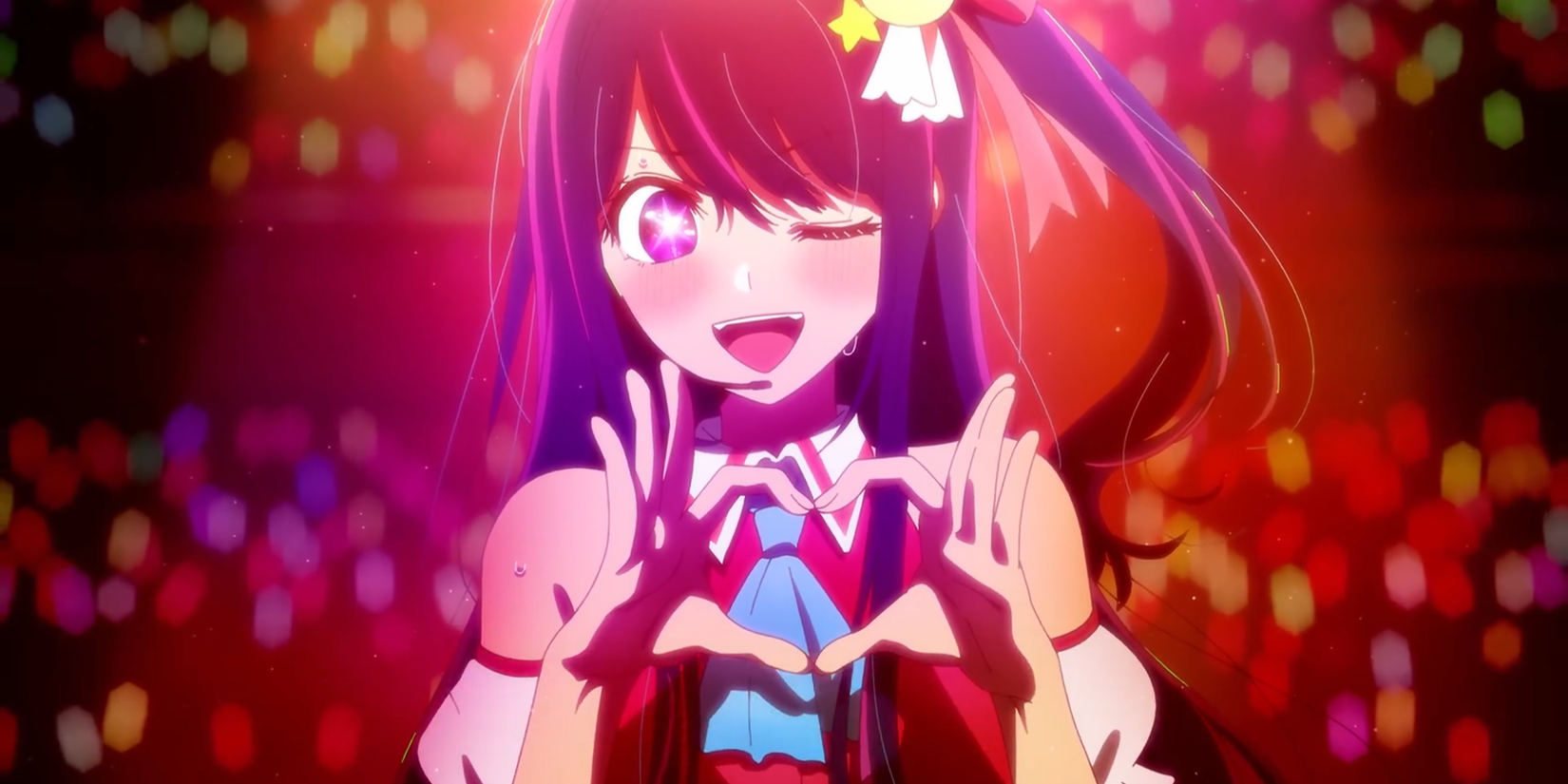 Oshi no Ko Episode 1 Ai Hoshino winks and holds up a heart during a concert