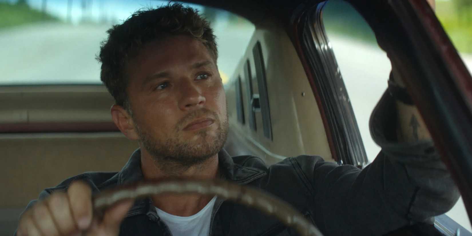 Logan (Ryan Phillippe) looks into his car's rearview mirror in Motorheads.