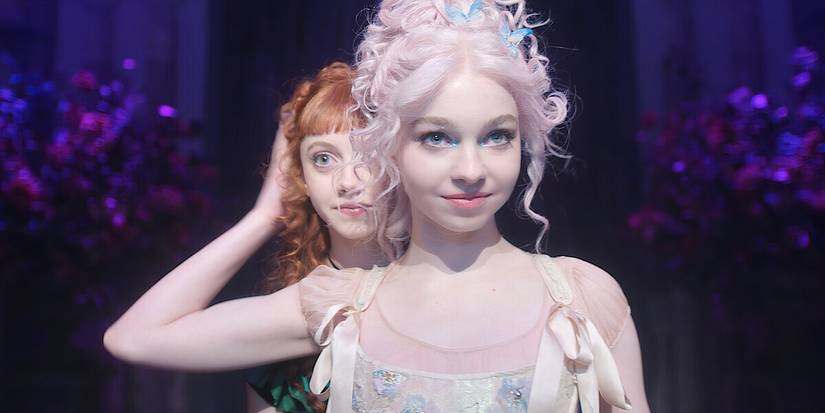 Agnes appears from behind Enid during their dance number