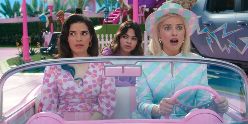 Gloria, Sasha and Barbie driving through Barbieland in Barbie.