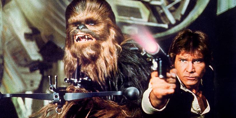 Chewbacca holds his bowcaster and Han Solo points his blaster in Star Wars Episode IV - A New Hope (1977)