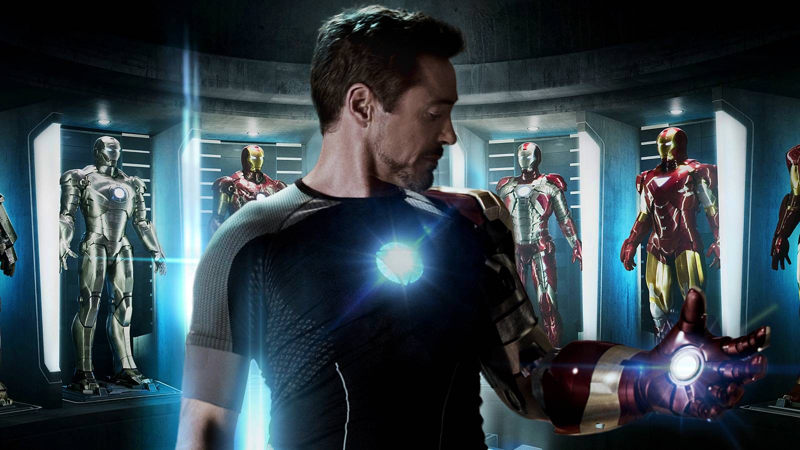 Robert Downey Jr as Tony Stark with his armors behind him from Iron Man 3