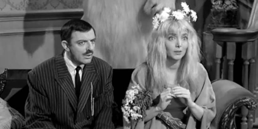 Gomez and Ophelia sitting together in The Addams Family.