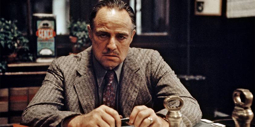 Don Corleone sitting at a desk in The Godfather